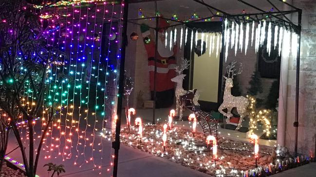 Doris Schouten and her husband use recycled Christmas decorations for their Logan Village display. Picture: Supplied.