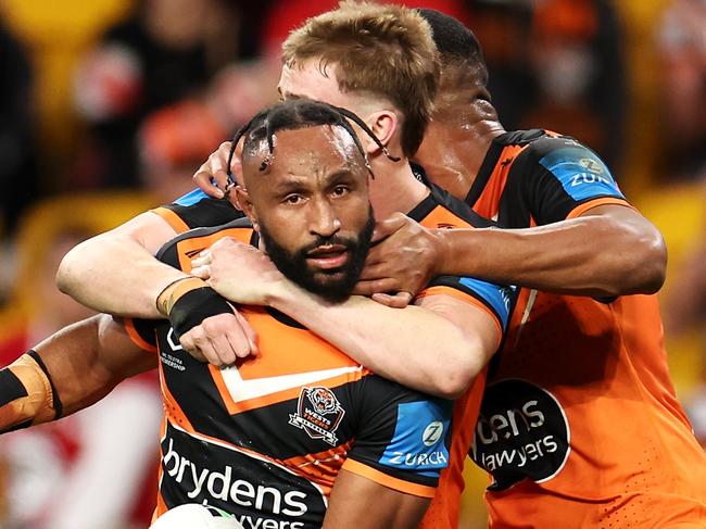 BRISBANE, AUSTRALIA - MAY 19: Justin Olam of the Wests Tigers celebrates with his team mates after scoring a try during the round 11 NRL match between Wests Tigers and Dolphins at Suncorp Stadium, on May 19, 2024, in Brisbane, Australia. (Photo by Hannah Peters/Getty Images)