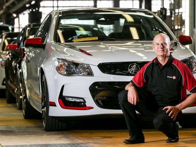 Michael Hatchard, General Assembly Quality Co-Ordinator with 28 Years service at GMH next to The vehicles in ‘The Commodore Collection’ which will be amongst the last to roll off the Elizabeth production line - picture Russell Millard