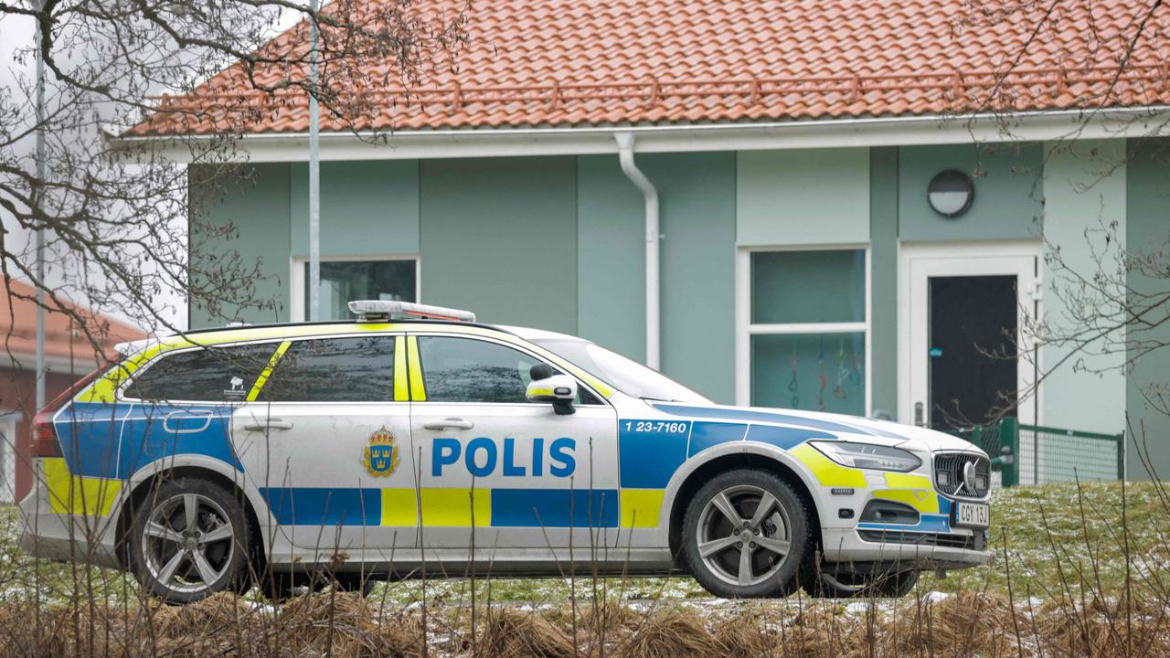 A police vehicle is seen near the Risbergska School building in Orebro, Sweden. (Photo by Kicki NILSSON / TT NEWS AGENCY / AFP) / Sweden OUT