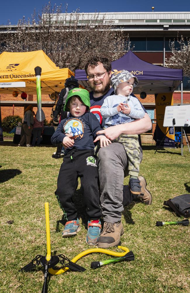 Launching an air-powered rocket are (from left) Alistair, Cameron and Kaladin Ryle at iLAuNCH Space family fun day, part of UniSQ's Open Day, Sunday, August 18, 2024. Picture: Kevin Farmer