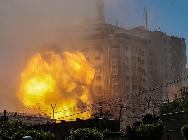 A ball of fire erupts from the Jala Tower as it is destroyed in an Israeli air strike in Gaza city controlled by the Palestinian Hamas movement. Picture: Mohammed Abed / AFP