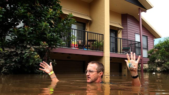 Glen Middleton returned to his house in his flooded street in Graceville, Brisbane for the first time since being evacuated.