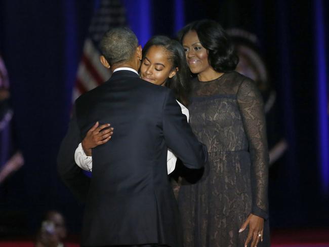 Obama with his eldest daughter Malia, 18, and First Lady Michelle Obama after giving his presidential farewell address. Picture: Charles Rex Arbogast/AP Photo