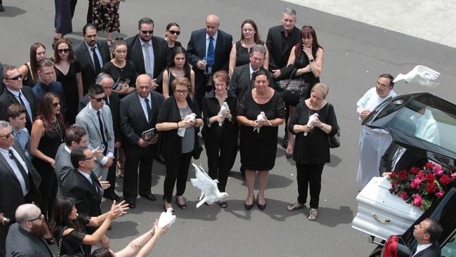 Mourners release doves at the funeral for Jessica Falkholt at St Marys Catholic Church in Concord, Sydney. Picture: AAP