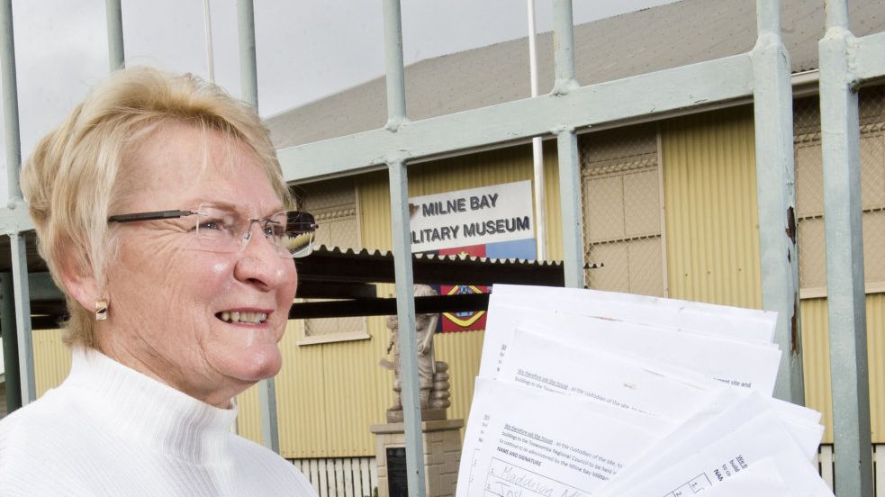 SUPPORTERS SIGN: Milne Bay Military Museum president Marian Jones with many signatures to save the museum. Thursday, 5th Jul, 2018. Picture: Nev Madsen