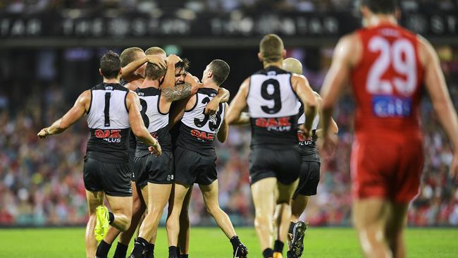 Riley Bonner of the Power celebrates kicking a goal with teammates against the Swans. Picture: Brett Hemmings/AFL Media/Getty Images