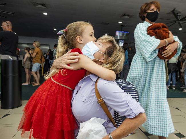 Five-year-old Isabel reunites with grandma Martine Calleeuew at Sunshine Coast airport after the first flight from Sydney touches down. Picture: Lachie Millard