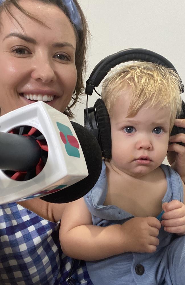 Abby Coleman working from home with her helper, son Koa.