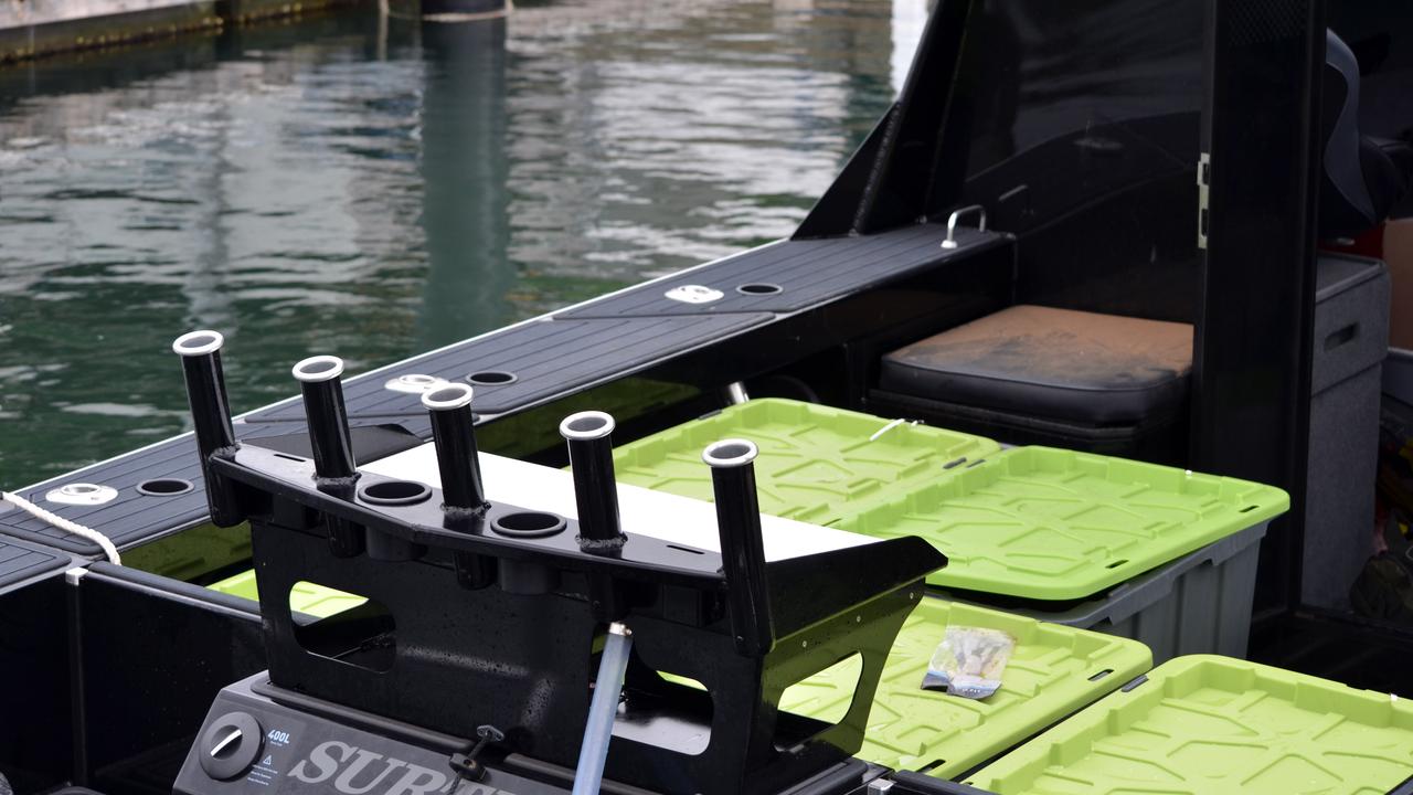 Police will allege 11 large green-lidded tubs found in the hull of the boat were holding bundles of cocaine wrapped in black plastic bags. Picture: Australian Federal Police