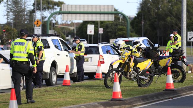 Queensland Police set up a road block due to the Corona Virus at the NSW / Queensland Border on the old Pacific Highway at Coolangatta.Photo: Scott Powick Newscorp