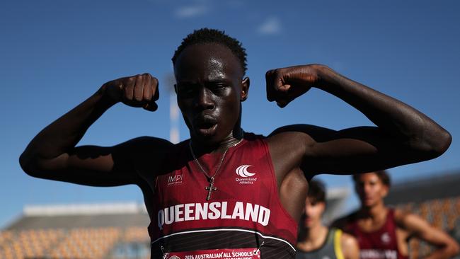 BRISBANE, AUSTRALIA - DECEMBER 07: Gout Gout of Queensland celebrates winning the Boys' U18 200m Final in a new national time of 20.04 seconds during the 2024 Chemist Warehouse Australian All Schools Athletics Championship at Queensland Sport and Athletics Centre on December 07, 2024 in Brisbane, Australia. (Photo by Cameron Spencer/Getty Images)