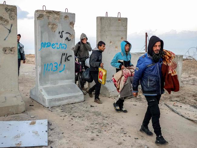 Others carried what belongings they could. Picture: AFP