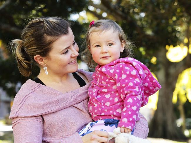 Victor Chang researcher Joelene Greasby, with daughter Penelope, lost her unborn baby just before the ceremony. Picture: Justin Lloyd.