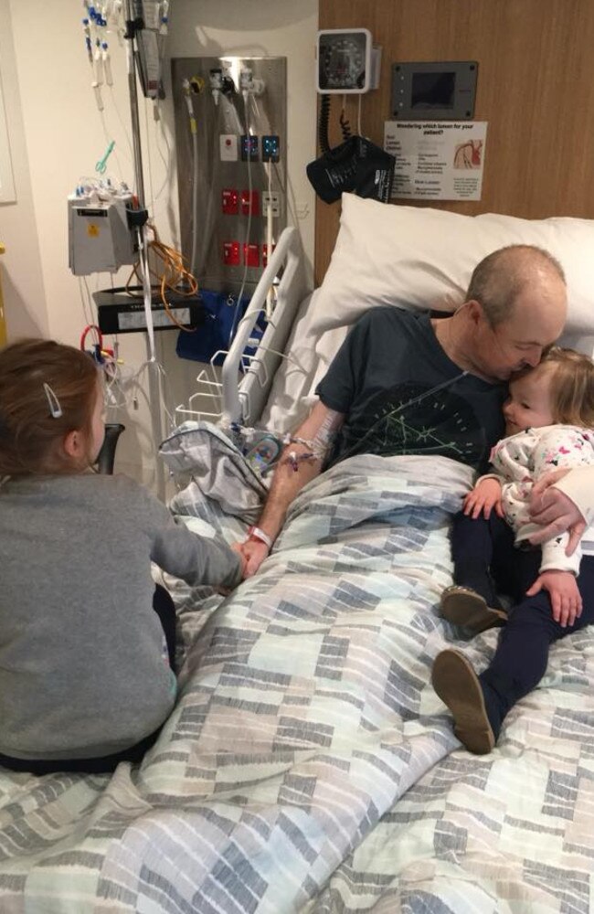 Lyle’s wife Briony shared this heartbreaking image on social media of the golf star in hospital with his daughters Lusi and Jemma. Picture: Facebook/Jarrod Lyle