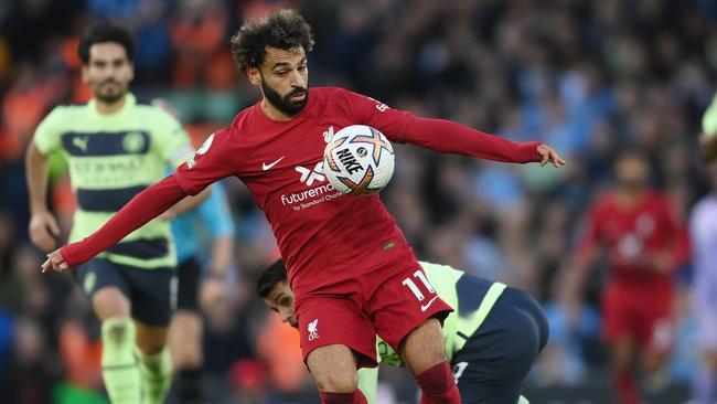 LIVERPOOL, ENGLAND - OCTOBER 16: Mohamed Salah of Liverpool gets away from Joao Cancelo of Manchester City to go on and score their side's first goal during the Premier League match between Liverpool FC and Manchester City at Anfield on October 16, 2022 in Liverpool, England. (Photo by Laurence Griffiths/Getty Images)