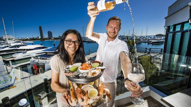 La Luna dining staff Jeanette Quezada and Jacob Collins with fresh seafood. Picture: Nigel Hallett