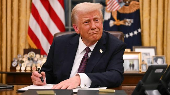 US President Donald Trump signs executive orders in the Oval Office of the White House. Picture: AFP