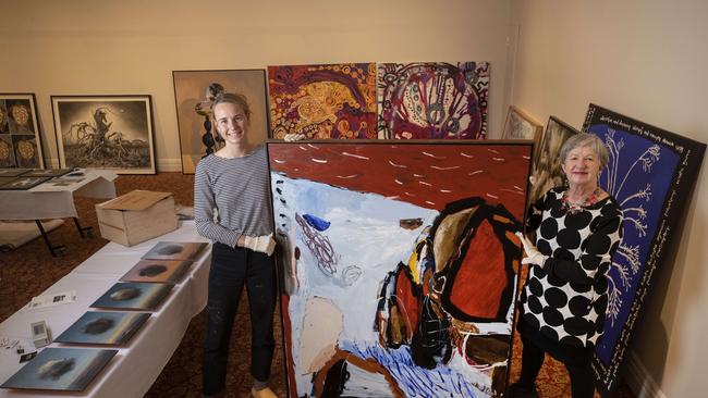 Hadley's Art Prize Packing Room Winner Zoe Grey with her work titled The Shape of Rock with unpacking team member Julie Payne. Picture: Chris Kidd