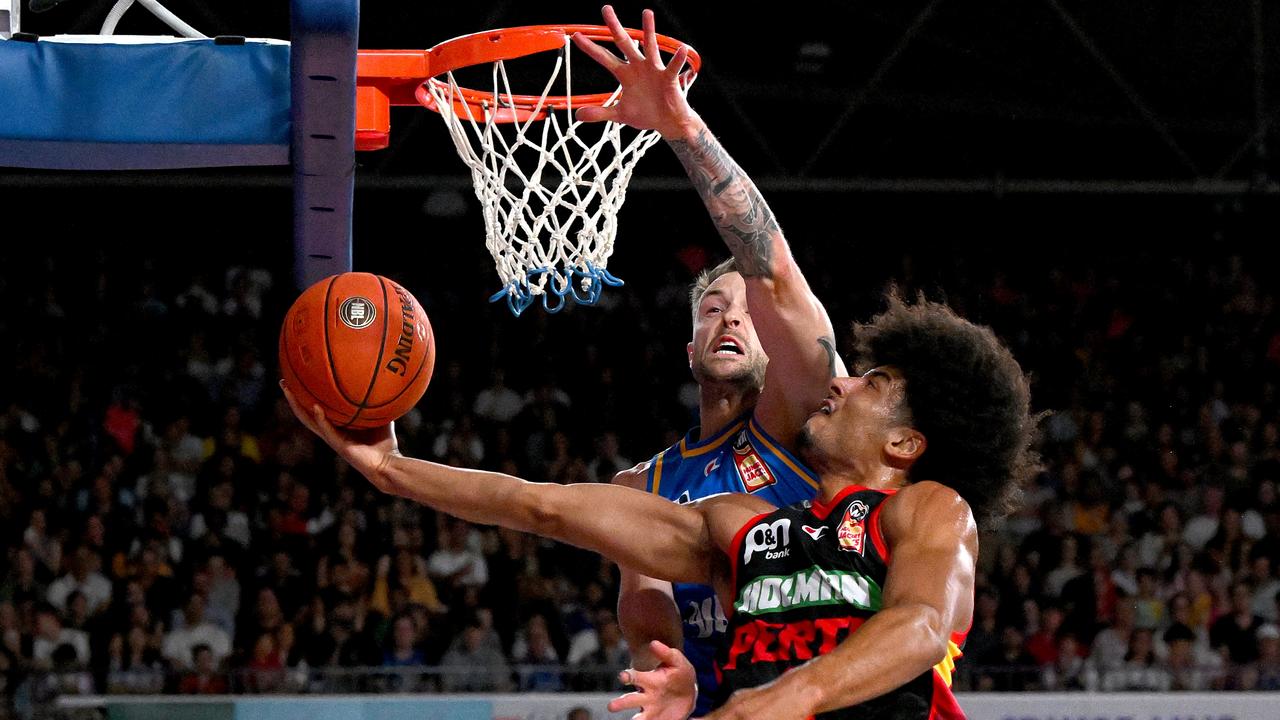 Tai Webster takes on Brisbane’s Nathan Sobey in Perth’s win. Picture: Bradley Kanaris/Getty Images