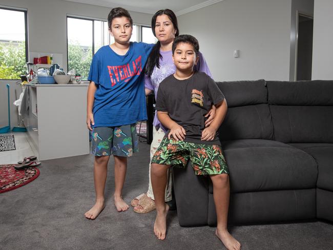 Hassinah Dadyar and her sons Sami and Osman in their Rosehill apartment. Picture: Julian Andrews