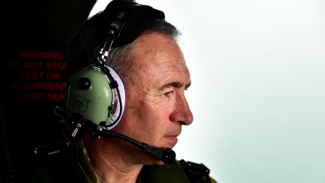 Mark Beretta on board an MRH-90 during a flypass over the Townsville 400 Supercars event. Picture: Alix Sweeney