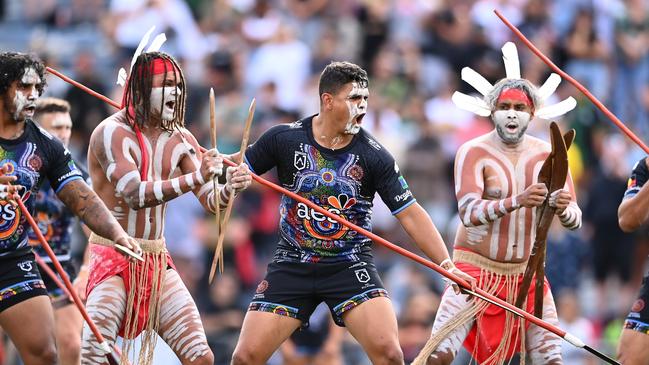 Rabbitohs star Latrell Mitchell (pictured centre) has copped racial abuse in his time in the NRL. (Photo by Hannah Peters/Getty Images)