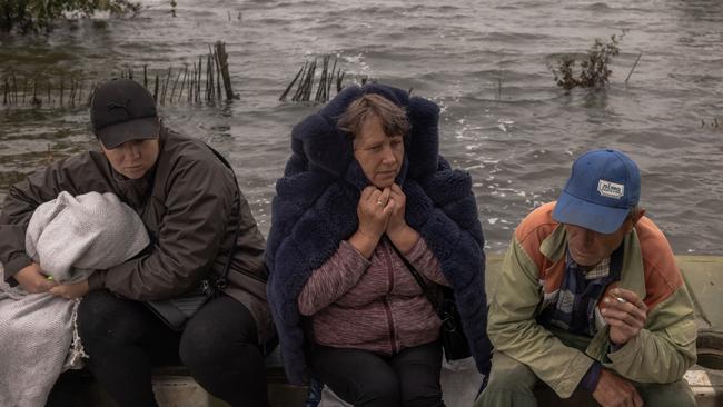 Residents wait for a transfer in a flooded area as the result of the Kakhovka dam destruction last week. Picture: Getty Images