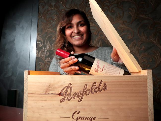 Daphne Reddy with one of the bottles of Penfolds Grange, which will auctioned this Sunday as a full set by du Plessis auction house. Picture: Dylan Coker