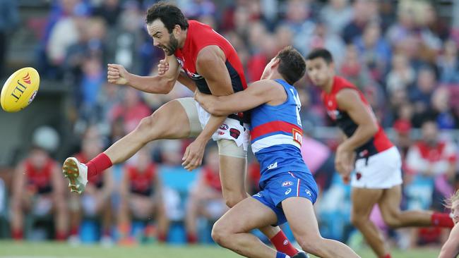 Jordan Lewis is tackled trying to get a kick away. Picture: Michael Klein