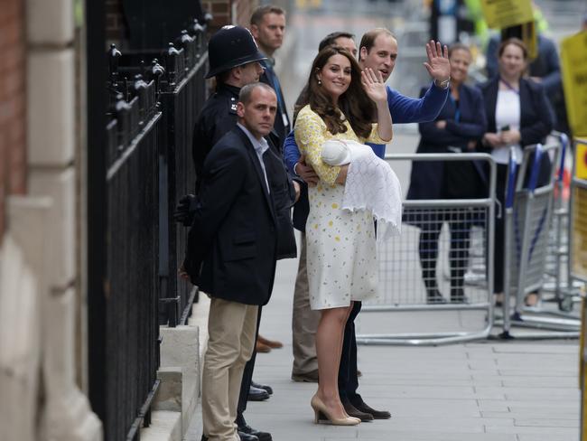 Britain's Prince William and Kate, Duchess of Cambridge and their newborn baby princess, wave to the public as they leave St. Mary's Hospital's exclusive Lindo Wing in London, Saturday, May 2, 2015. The Duke and Duchess of Cambridge and their new daughter left hospital to travel home to Kensington Palace in London.(AP Photo/Tim Ireland)