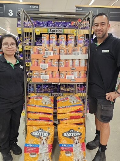 At Woolworths Mt Isa, manager Matt Piper said staff including Suntreeya (left) and Rewi (right) helped to pack up the store's donation of pet supplies for the rescued dogs at Burketown. Picture: Supplied