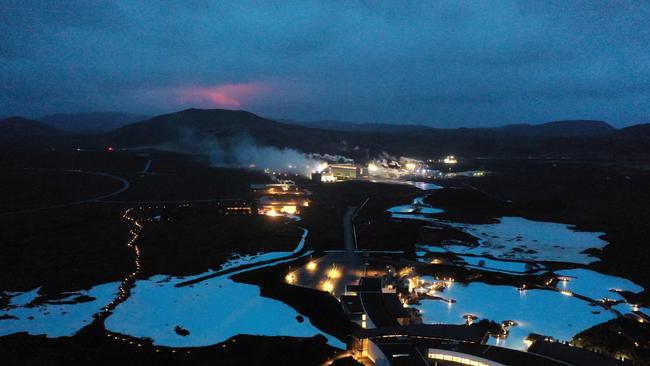 The red shimmer from magma is seen coming out from the erupting Fagradalsfjall volcano, near the town of Grindavik on March 20, 2021. Picture: AFP.