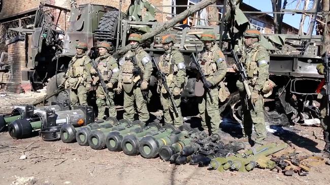 Russian soldiers display captured Western-made portable missile systems from Ukrainian service members. Picture: Eyepress