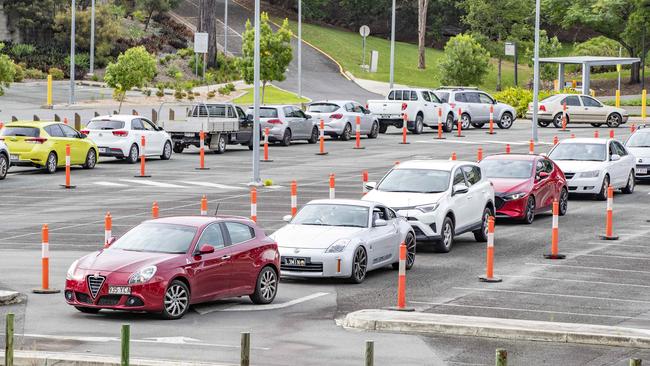 People are directed to QUT Kelvin Grove drive through COVID testing as RBWH Royal Brisbane and Women's Hospital COVID testing is closed. Picture: Richard Walker