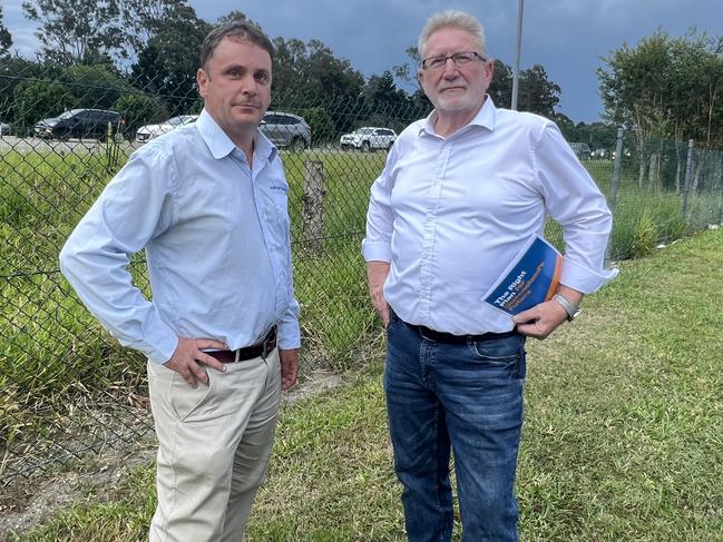 Theodore MP Mark Boothman and Coomera MP Michael Crandon beside the M1 at Coomera on Tuesday October 8 where they announced a commitment of $5 million towards a business case for east west connections across the M1 if the LNP is elected. Picture: Keith Woods.