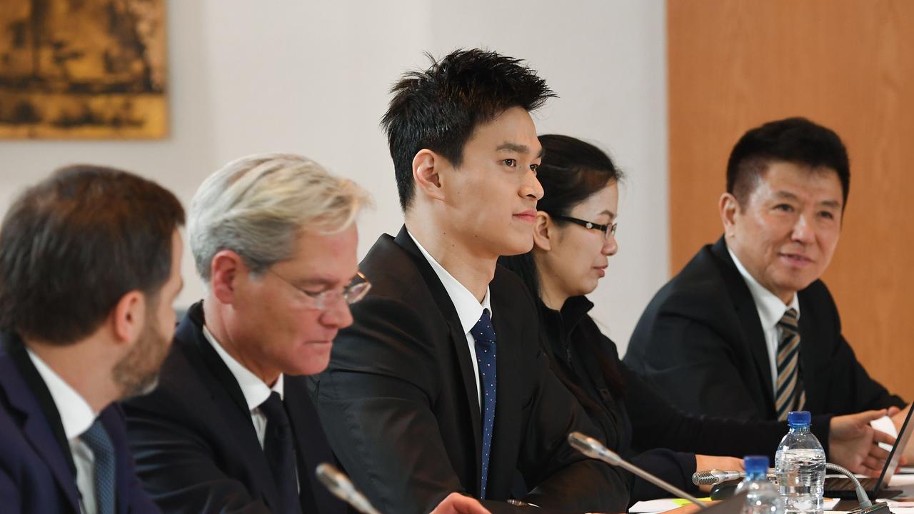 Sun (centre) at a hearing before the Court of Arbitration for Sport (CAS) in Montreux on November 15, 2019. (Photo by Jean-Guy PYTHON / AFP)