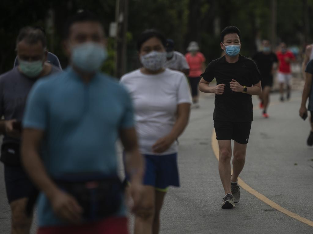 People out and about in Lumphini Park in Bangkok on Wednesday as Thai authorities ease Covid restrictions. Picture: Sirachai Arunrugstichai/Getty Images