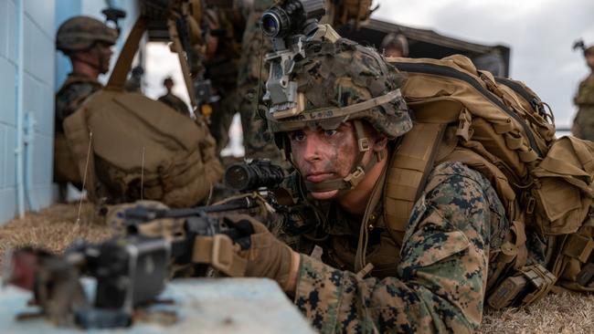 US Marine Lance Corporal John-Phillip Raper, from 1st Battalion, 7th Marines, keeps watch during an assault on Bowen airport during Exercise Talisman Sabre 2021. Picture: LACW Jacqueline Forrester