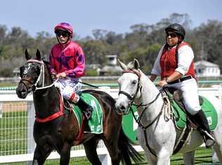 Jockey Adin Thompson returns to the Ipswich enclosure after his winning ride aboard Devil's Temptation. Picture: Rob Williams