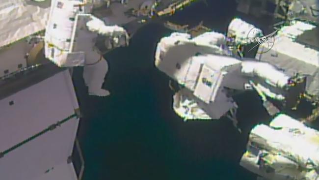 This NASA TV video grab image obtained on October 10, 2017 shows astronauts outside the International Space Station. Two US astronauts embarked Tuesday on the second spacewalk this month to make much-needed repairs to the International Space Station's robotic arm, NASA said.Expedition 53 Commander Randy Bresnik is leading the outing, accompanied by NASA flight engineer Mark Vande Hei.  / AFP PHOTO / NASA TV / Handout / RESTRICTED TO EDITORIAL USE - MANDATORY CREDIT "AFP PHOTO / NASA TV/HANDOUT" - NO MARKETING NO ADVERTISING CAMPAIGNS - DISTRIBUTED AS A SERVICE TO CLIENTS