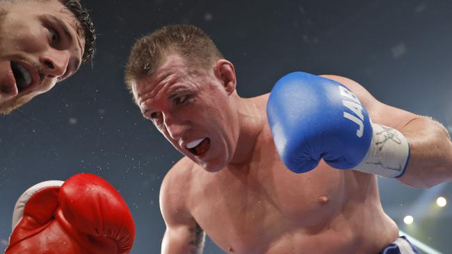 Paul Gallen throws a punch during the Australasian Heavyweight Title bout against Kris Terzievski