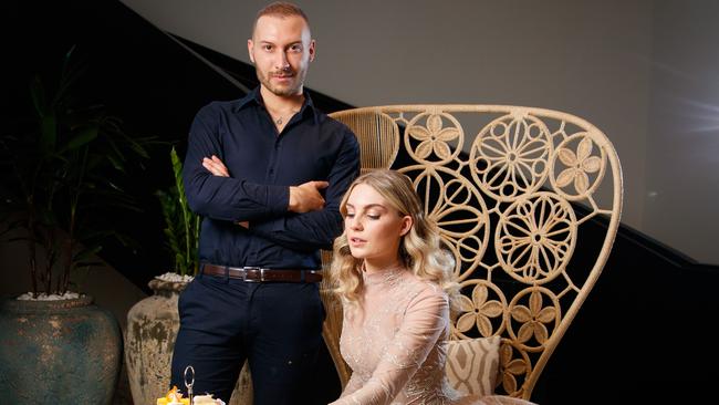 Paul Vasileff with model Georgia Bess from Finesse, serving high tea at the Mayfair Hotel. Paul's label Paolo Sebastian, will be joining forces with the prestigious Mayfair hotel to host two glamorous and intimate high tea events to celebrate Vogue Festival. Picture MATT TURNER.