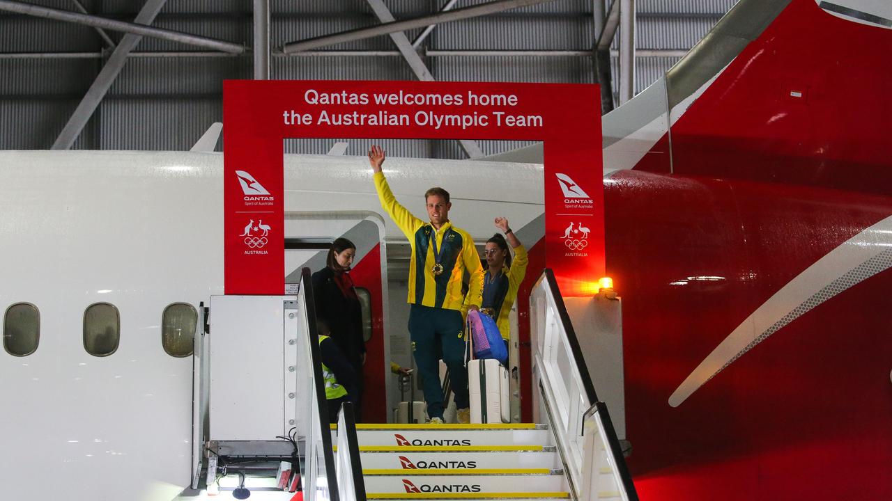 A choir rang out as the Olympians stepped off the plane at Sydney Airport on Wednesday morning. Picture: NewsWire / Gaye Gerard