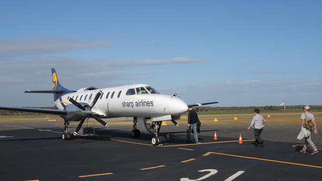 Passengers board a Sharp Airlines flight at King Island.