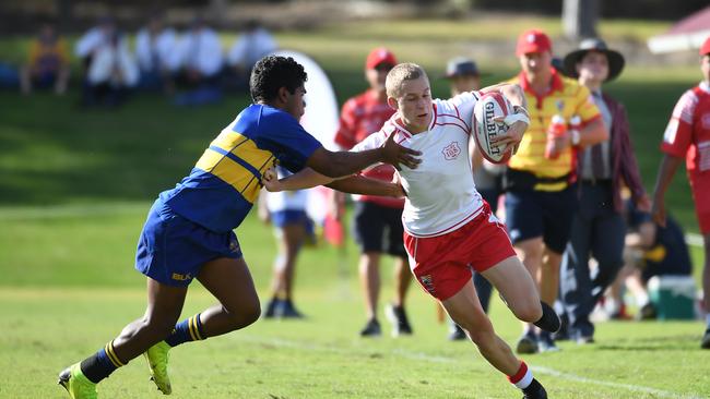 Ipswich Grammar School winger Malique Douthat-Sjoberg fends off Toowoomba Grammar’s Allister Cameron.