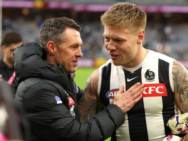 PERTH, AUSTRALIA - JUNE 03: Craig McRae head coach of the Magpies talks with Jordan De Goey after winning the round 12 AFL match between West Coast Eagles and Collingwood Magpies at Optus Stadium, on June 03, 2023, in Perth, Australia. (Photo by Paul Kane/Getty Images)