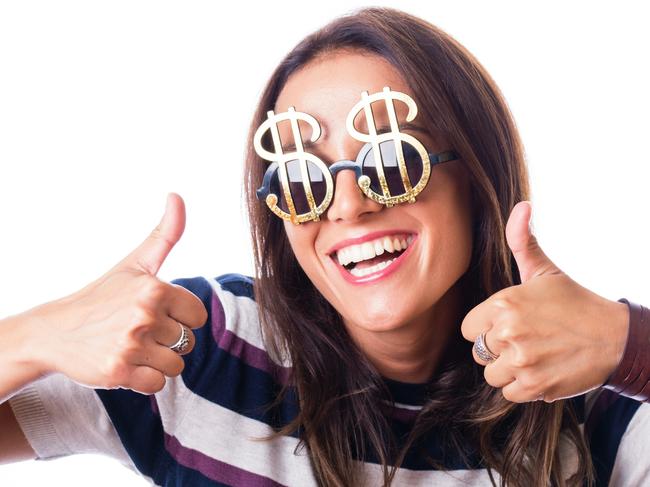 Laughing woman with Dollar sunglasses showing thumbs up with both hand, studio shot isolated on white; money celebration generic