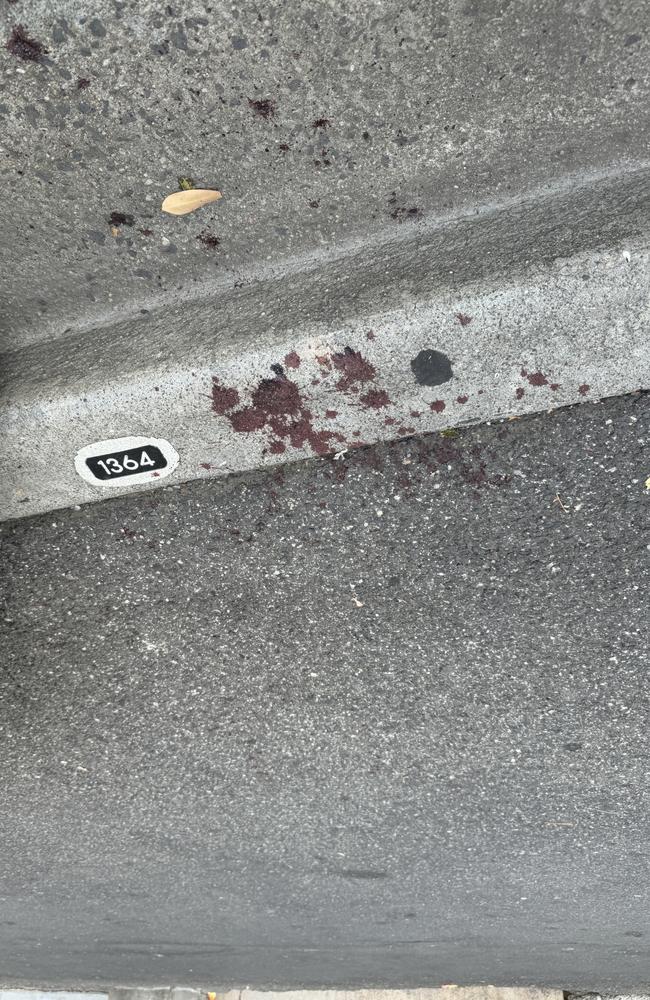 Blood spatters remain at the scene of a vicious stabbing in Footscray on Friday night. Picture: Regan Hodge