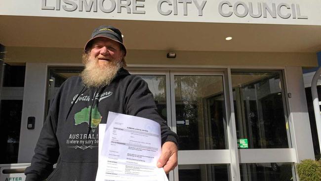 Bundjalung elder Michael Ryan delivering a NSW Land and Environment Court Summons on the Lismore City Council. Picture: Leah White